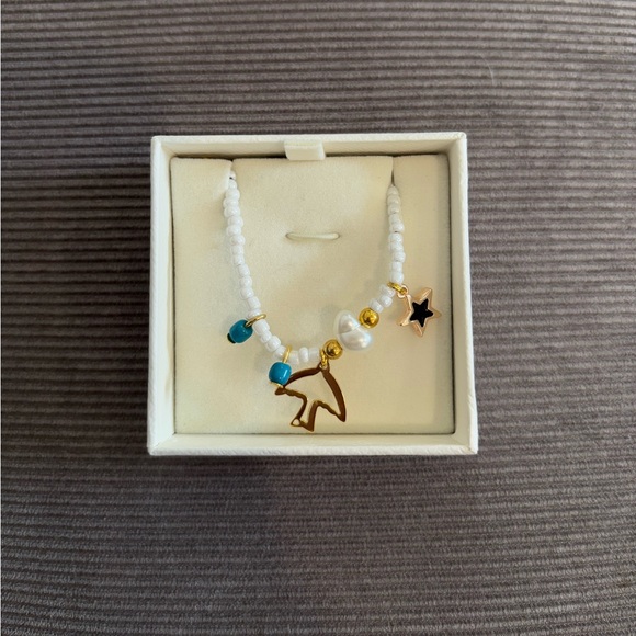 Handmade White Beaded Necklace with Gold Star and Charm - Picture 5 of 5